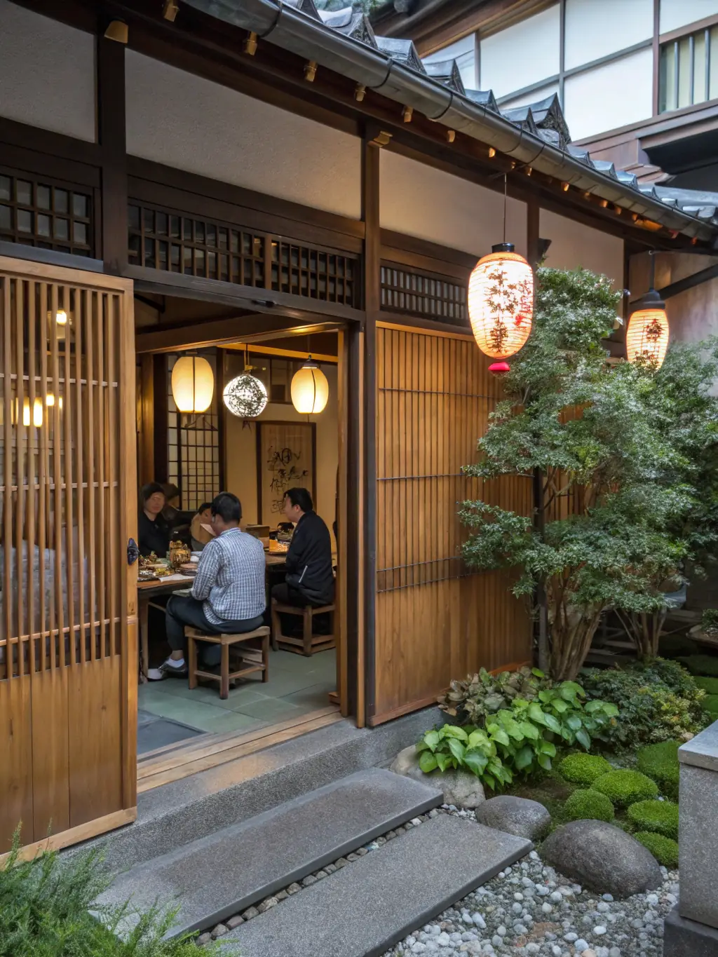 A photograph of the exterior of the Japanese restaurant, showcasing its traditional architecture and inviting entrance, with people dining outside.