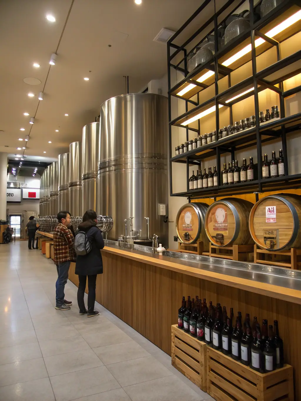 A photograph of the interior of the craft sake brewery, highlighting the brewing equipment and tasting area, with people sampling different sakes.